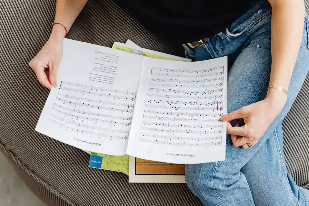 Student reviewing sheet music