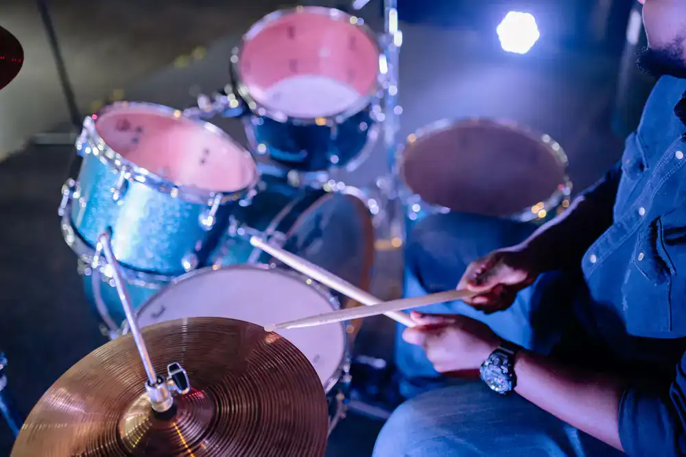 Overhead view of a drum kit being played