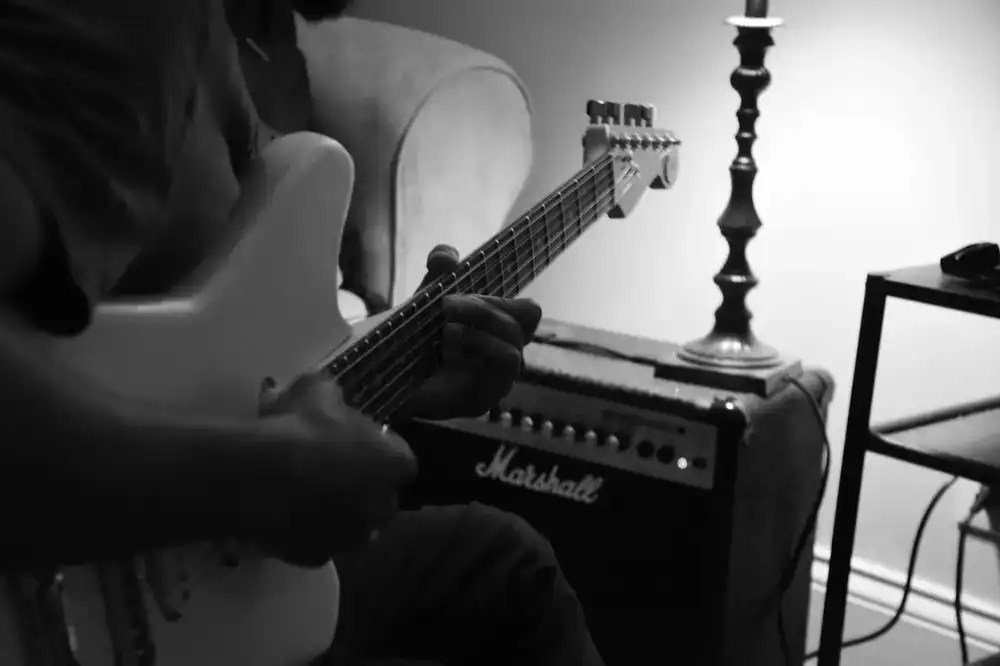Student practicing electric guitar