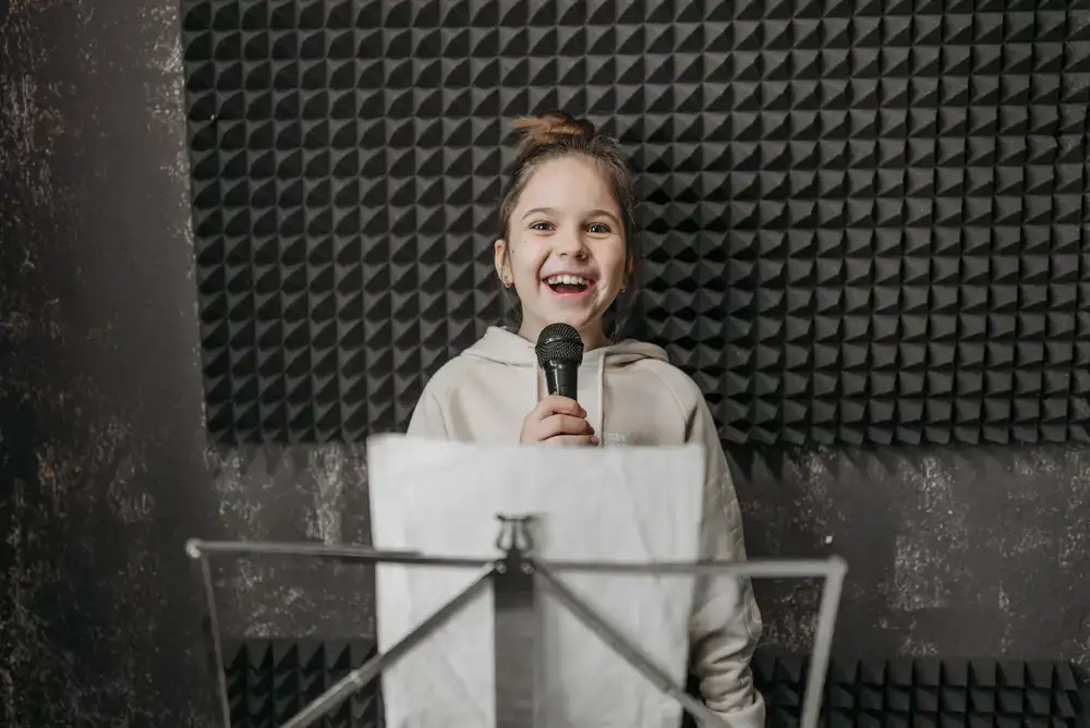 Vocal student singing into a microphone